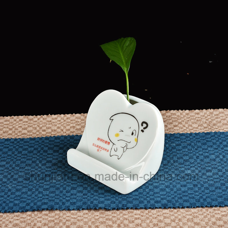 M&atilde;o desenho tipo vaso de cer&acirc;mica suporte do telefone m&oacute;vel