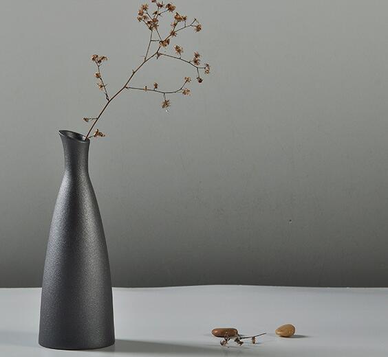 Artigos de decora&ccedil;&atilde;o em cer&acirc;mica para decora&ccedil;&atilde;o de casa em vaso preto