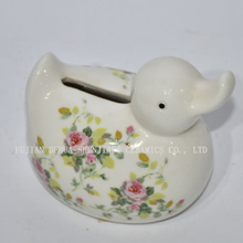 Pato pequeno de cerâmica com decalques de flores Mealheiro
