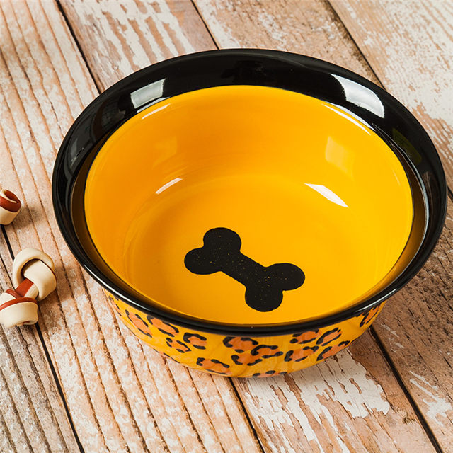Impressão inferior da tigela Imagens de osso Alimentador de animais de cerâmica amarelo Tigela de cerâmica para cães Circular