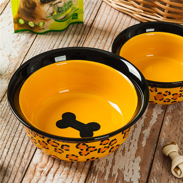 Impressão inferior da tigela Imagens de osso Alimentador de animais de cerâmica amarelo Tigela de cerâmica para cães Circular