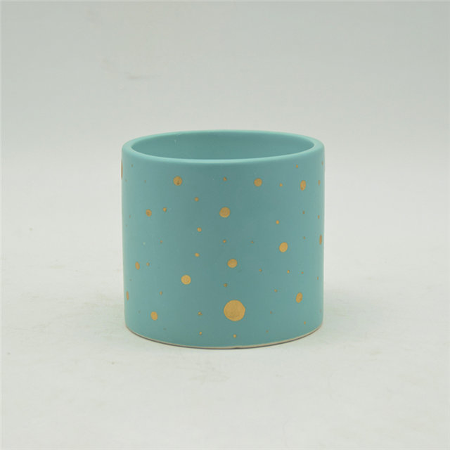 Copos de vela de cerâmica manchados de azul e dourado