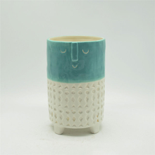 Expressão verde e branca dos desenhos animados personagem vaso de cerâmica de quatro pernas